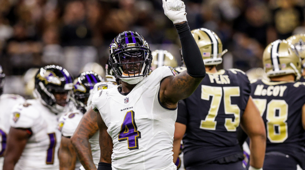 Nov 7, 2022; New Orleans, Louisiana, USA; Baltimore Ravens linebacker Jason Pierre-Paul (4) signals a 4th down stop against the New Orleans Saints during the first half at Caesars Superdome. Mandatory Credit: Stephen Lew-USA TODAY Sports  